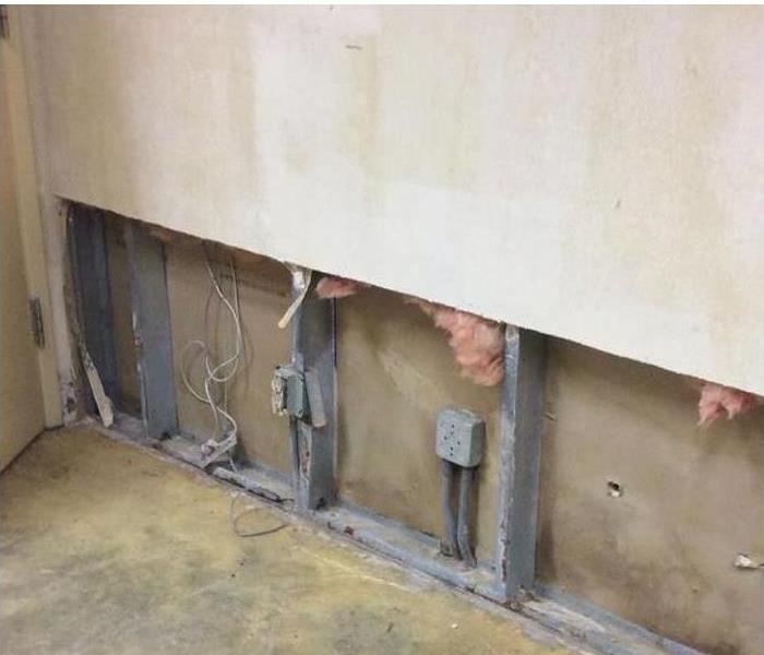 Wall with outlets and studs exposed