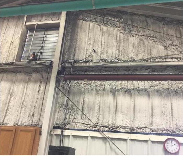 soot-covered warehouse walls