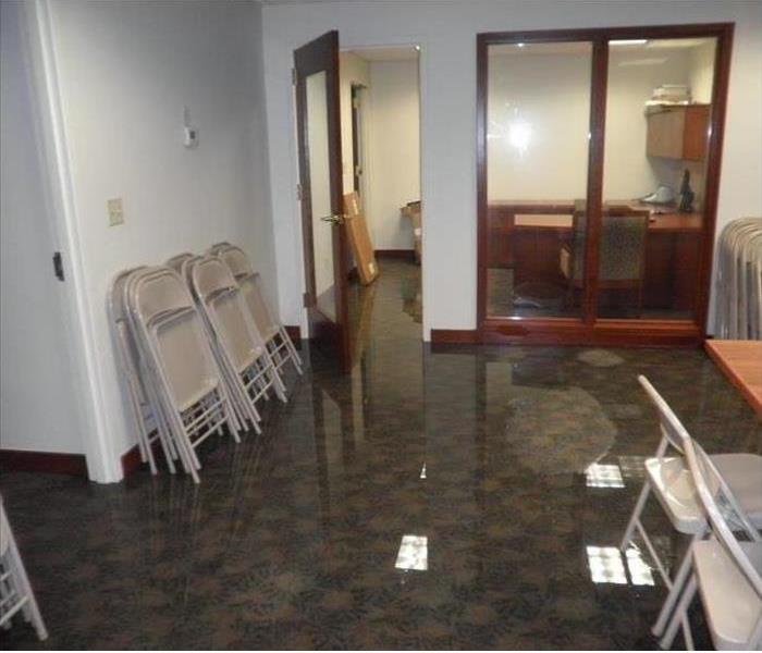 Office with standing water on the carpet 