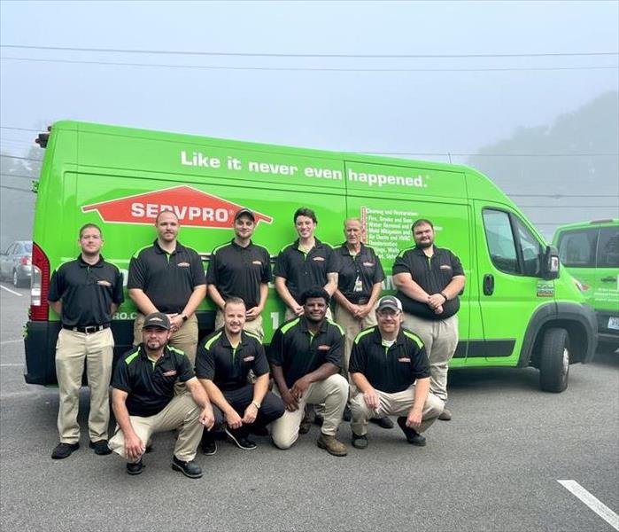 SERVPRO of Washington County employees posing for a photo in front of a truck.