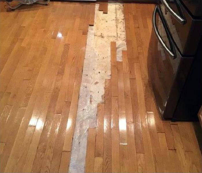 water leak damaged wood flooring