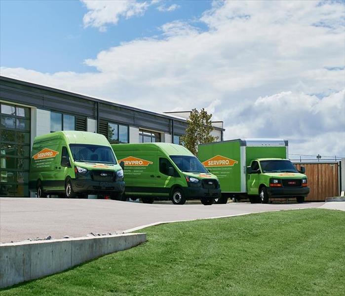 SERVPRO vehicles in a parking lot.
