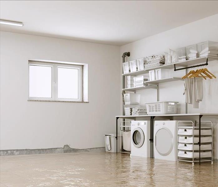 A basement is flooded and water is on the floor.
